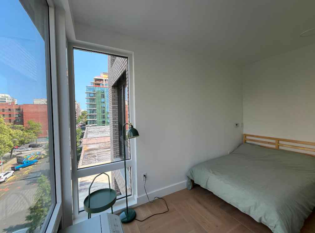 Room in a 3 bdrm new apartment with 4 bright floor to ceiling windows. 2 female roommates between the ages of 22 and 30 who are students/professionals. This apartment has everything from a kitchen island, in-unit laundry, gym, rooftop, to workspaces, phone booths, a sauna, foosball, yoga studio, movie theatre, and mail room.

Amenities are included within the $1850 price. The train stations are a quick/medium walk away, 10 min to Atlantic Barclays terminal and 10 to Bergen St, so practically access to the entire city with every train line outside the L7JZ.

On the 6th floor so plenty of privacy from the ground with views of the tall trees ahead. I love this place! But life tends to send one on peculiar paths. Message me for more details!