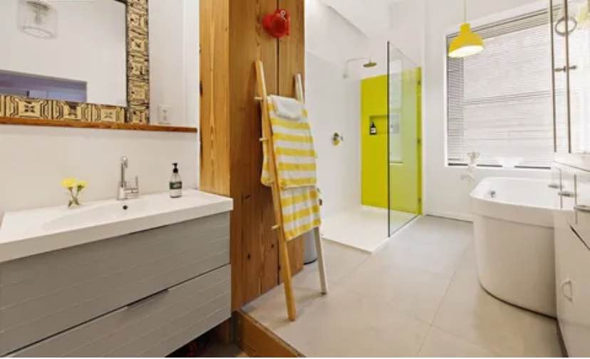 Welcome home to your renovated 2450 square foot corner loft paradise facing tree tops and Manhattan.
This is a room in an exquisite two-bedroom two bath residence boasting direct views of the Empire State Building and the Manhattan and Verrazzano Bridges. It also has partial views of the river. Custom features include: 1. Poggenpohl kitchen with a stainless-steel island, Subzero and Miele appliances, and stone counter tops and ample custom lacquer cabinetry. 2. Both gas and induction Miele cook tops and double ovens. 3. Large laundry room with folding table and storage. 4 3.5 renovated bathrooms and a sleek powder room with pops of color. 5. A lovely hallway outfitted with more custom paneling connecting the bedrooms and a storage area or library. The first living room is spacious and has ample room for sectional seating and a large dining area with a small alcove leading to the private outdoor space. Additional dining, cocktails and gardening are a joy on the ample terrace outfitted with wooden slats, custom benches, storage, electricity and of course those views! Both bedrooms are spacious and have corner windows and ensuite bathrooms.. The primary also has direct views of the Empire State Building and the Manhattan Bridge, a dressing area, four double closets, a small library, and room for additional furniture. The windowed bathrooms are nothing short of breathtaking with pops of citrus colors, The original lackluster sponsor bathrooms were completely renovated to include Duravit fixtures and custom glass tiles and heated ceramic tiled floors. The massive free-standing tub in the primary is ideal for relaxation 13J provides an additional 845 square feet of living space. It is accessible from a graceful foyer with two massive walls of storage and a custom wall of wood paneling matching the halls in 13I. The open plan corner second living room is bright and airy with refreshing pops of color and mod features. This expansive loft provides a massive second living room with open sky views on both sides, a second kitchen, and a den or a fourth bedroom. The current third bedroom faces the quiet bliss of Duffield Street. The renovated bathroom is a dream with mod design elements and pop colors. Own a piece of landmarked Brooklyn history in a Ralph Walker building. Designed in 1928, BellTel lofts is a unique prewar building with a spectacular lobby adorned with marble and hand sculpted metal work. Walker was voted architect of the century by the American Institute of Architects for his contribution to modern design. A suite of amenities includes 24-hour concierge, attended package room, two recently upgraded landscaped roof decks, live-in super, fully equipped gym, yoga room, media room with kitchen, five elevators, kid's play room, bike room, valet parking and storage for a fee. Easy access to almost every subway lines (R/Q, B, 2/3, 4/5, A/C, F, G ). Soho and the Lower East Side are only one stop away. Across the street you will find a BRAND NEW 1 ACRE PARK being finalized in front of the City Point Center which includes Trader Joe's, Century 21, Alamo Drafthouse and 20+ food vendors and bars within Dekalb Market Food Hall. Fine dining is available at trendy Gage & Tolner just steps from the building. Sprawling Fort Greene park is only a few blocks away. Bordering multiple neighborhoods, Downtown Brooklyn is surrounded by Fort Greene, Boerum Hill, or Cobble Hill within minutes. Brooklyn Heights, the Promenade and Brooklyn Bridge Park are only fifteen minutes away