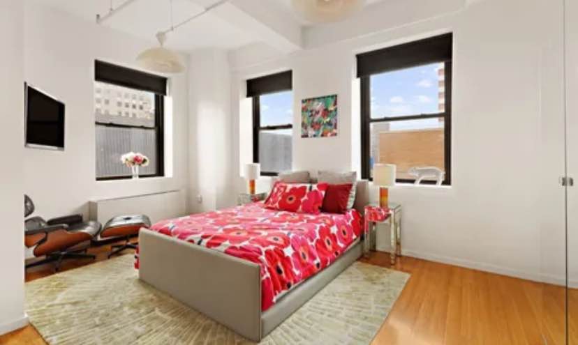 Welcome home to your renovated 2450 square foot corner loft paradise facing tree tops and Manhattan.
This is a room in an exquisite two-bedroom two bath residence boasting direct views of the Empire State Building and the Manhattan and Verrazzano Bridges. It also has partial views of the river. Custom features include: 1. Poggenpohl kitchen with a stainless-steel island, Subzero and Miele appliances, and stone counter tops and ample custom lacquer cabinetry. 2. Both gas and induction Miele cook tops and double ovens. 3. Large laundry room with folding table and storage. 4 3.5 renovated bathrooms and a sleek powder room with pops of color. 5. A lovely hallway outfitted with more custom paneling connecting the bedrooms and a storage area or library. The first living room is spacious and has ample room for sectional seating and a large dining area with a small alcove leading to the private outdoor space. Additional dining, cocktails and gardening are a joy on the ample terrace outfitted with wooden slats, custom benches, storage, electricity and of course those views! Both bedrooms are spacious and have corner windows and ensuite bathrooms.. The primary also has direct views of the Empire State Building and the Manhattan Bridge, a dressing area, four double closets, a small library, and room for additional furniture. The windowed bathrooms are nothing short of breathtaking with pops of citrus colors, The original lackluster sponsor bathrooms were completely renovated to include Duravit fixtures and custom glass tiles and heated ceramic tiled floors. The massive free-standing tub in the primary is ideal for relaxation 13J provides an additional 845 square feet of living space. It is accessible from a graceful foyer with two massive walls of storage and a custom wall of wood paneling matching the halls in 13I. The open plan corner second living room is bright and airy with refreshing pops of color and mod features. This expansive loft provides a massive second living room with open sky views on both sides, a second kitchen, and a den or a fourth bedroom. The current third bedroom faces the quiet bliss of Duffield Street. The renovated bathroom is a dream with mod design elements and pop colors. Own a piece of landmarked Brooklyn history in a Ralph Walker building. Designed in 1928, BellTel lofts is a unique prewar building with a spectacular lobby adorned with marble and hand sculpted metal work. Walker was voted architect of the century by the American Institute of Architects for his contribution to modern design. A suite of amenities includes 24-hour concierge, attended package room, two recently upgraded landscaped roof decks, live-in super, fully equipped gym, yoga room, media room with kitchen, five elevators, kid's play room, bike room, valet parking and storage for a fee. Easy access to almost every subway lines (R/Q, B, 2/3, 4/5, A/C, F, G ). Soho and the Lower East Side are only one stop away. Across the street you will find a BRAND NEW 1 ACRE PARK being finalized in front of the City Point Center which includes Trader Joe's, Century 21, Alamo Drafthouse and 20+ food vendors and bars within Dekalb Market Food Hall. Fine dining is available at trendy Gage & Tolner just steps from the building. Sprawling Fort Greene park is only a few blocks away. Bordering multiple neighborhoods, Downtown Brooklyn is surrounded by Fort Greene, Boerum Hill, or Cobble Hill within minutes. Brooklyn Heights, the Promenade and Brooklyn Bridge Park are only fifteen minutes away