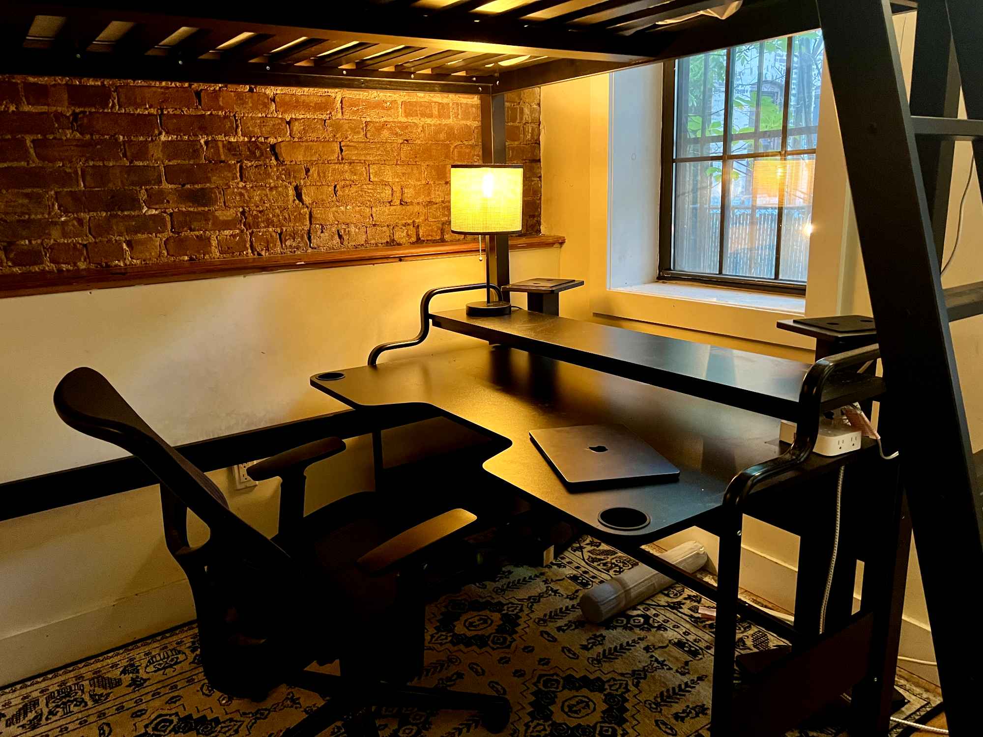 I'm leaving town until December and need someone to take my room! Move-ins as soon as the 15th and as late as the 1st will be accepted. No option to extend--this is hands down the best place I've lived since moving to NYC and I will definitely be coming back. But I'd be happy to have the room occupied in the meantime, and share such a great spot with someone cool.
The room is FULLY FURNISHED, with a lofted bed and full-sized memory foam mattress, a chest of drawers, a nice desk, and my speaker towers if you'd like to set up an audio system. It's on the smaller side, but made much more spacious thanks to the loft bed and a decently-sized closet. You'll be getting a surprising amount of sunlight, especially in the mornings, and the view right now is very nice and very green.
The apartment itself is even better than the room--it's a 4-bed with three (male) roommates, but I've never once felt crowded; the guys are chill and open-minded, and we've got 2.5 bathrooms between us, spread across two whole floors: the ground floor, and a private basement level with private backyard access. One room in the basement has been converted to a rehearsal space for musicians, since a lot of us here make music. Someone creative will feel right at home, but either way the rehearsal space is used respectfully with regards to those of us upstairs; if you need silence, you'll get it. The apartment also comes with a dishwasher and easy laundry access through the basement, both of which I've been very much appreciating.
Since I'll be off the grid, part of this process may be conducted by my roommates, and payment will be handled through Zelle exclusively. A background check will be conducted beforehand, but barring anything serious I don't intend on rejecting people if I can help it. Mostly I just want someone who seems like a good fit, who'll appreciate the space, and who'll get along well with my roommates.