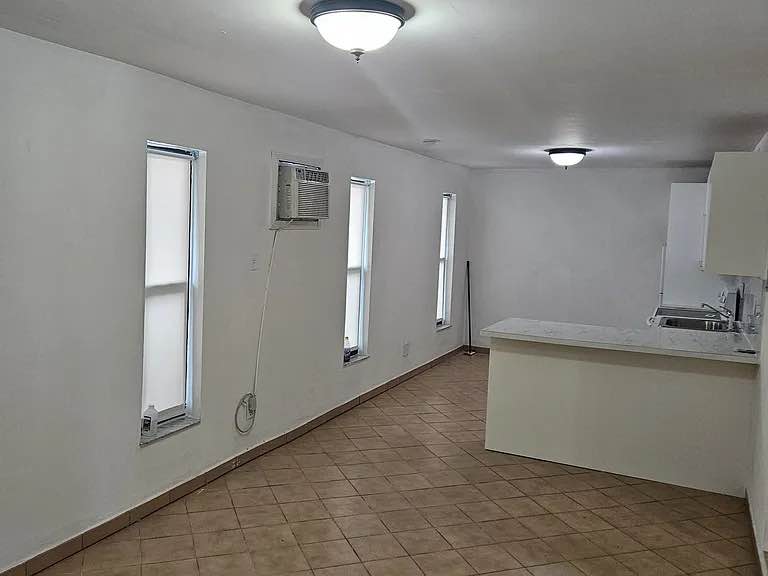 This unit features a spacious living room and an air conditionied space with a walk-in closet, sleeping area and dining space. The unit's kitchen has central heating, has tiled backsplash, laminate countertops, standard appliances, a gas-range stovetop, cabinet space and a disposal. The bathroom has a shower and tub combination. The bedroom offers a generous walk-in closet for ample storage. Enjoy the convenience of a private yard and a large storage shed in the back. Rent includes water, electricity, and yard maintenance making this home both comfortable and hassle-free.

Water and yard work included in pricing.