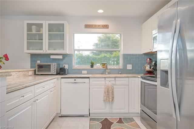 Private room and bathroom downstairs in my townhouse. My room is upstairs. Shared living room and kitchen with patio and garage access downstairs. 