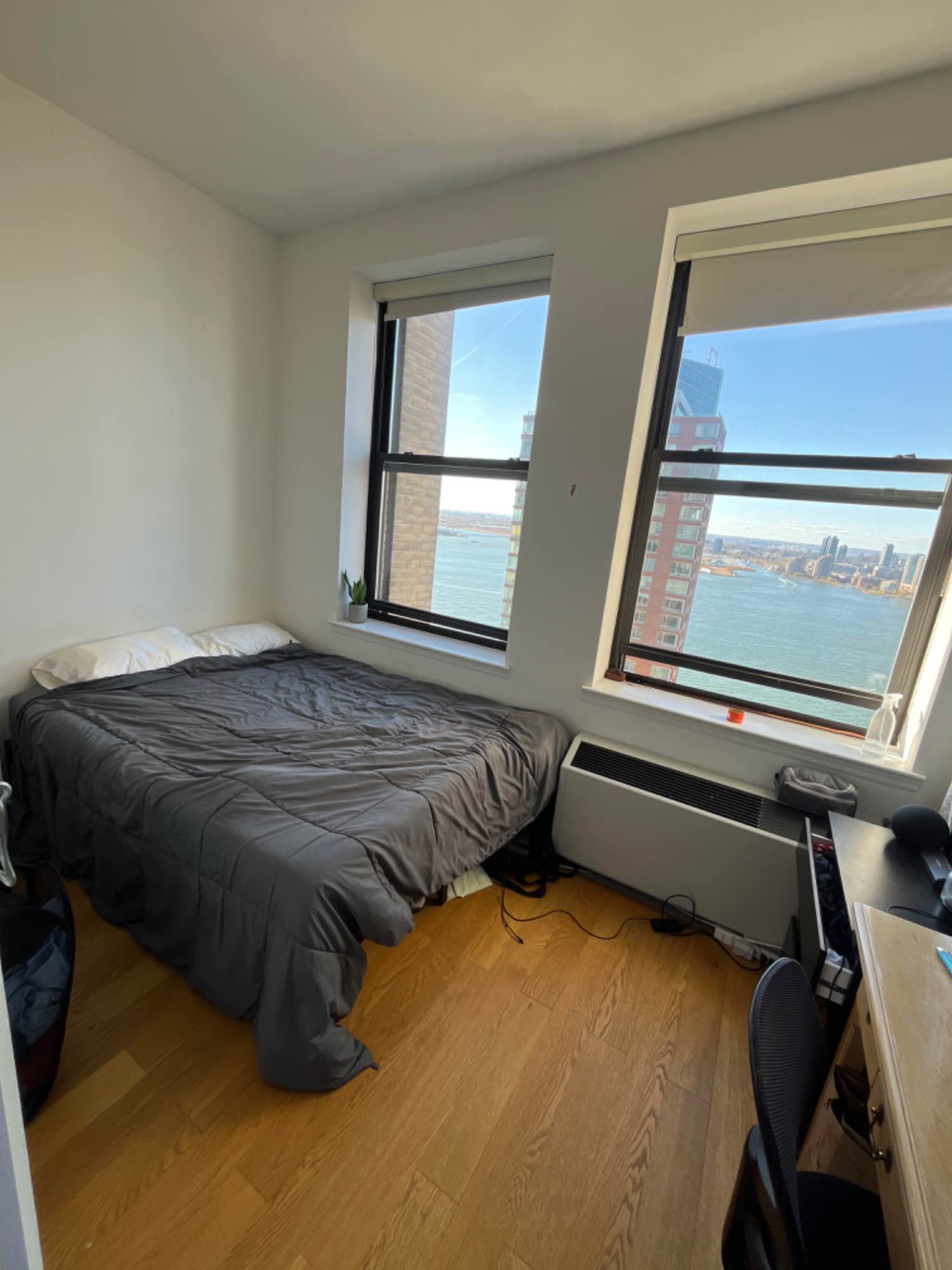 Hello, 
My name is Harvey and I’m currently pursuing a masters degree in finance. I currently share a room with my girlfriend and one dog. We also currently have a roommate, Justin, that is in the other room. We are renting out a room in our 3 bedroom apartment with 2 huge windows that face the Hudson River. The room does not have a closet since it’s a flexed room but we freed up a closet across the room which is available for you. 

A little bit about us, we are very relaxed, yet clean roommates. We are up for late night conversations but also respect quiet times. As of now, everyone has their designated shelf space in common areas but we are open to discuss living arrangements and will make more space (in kitchen cabinets etc. if needed). If you have any other questions, feel free to ask. 