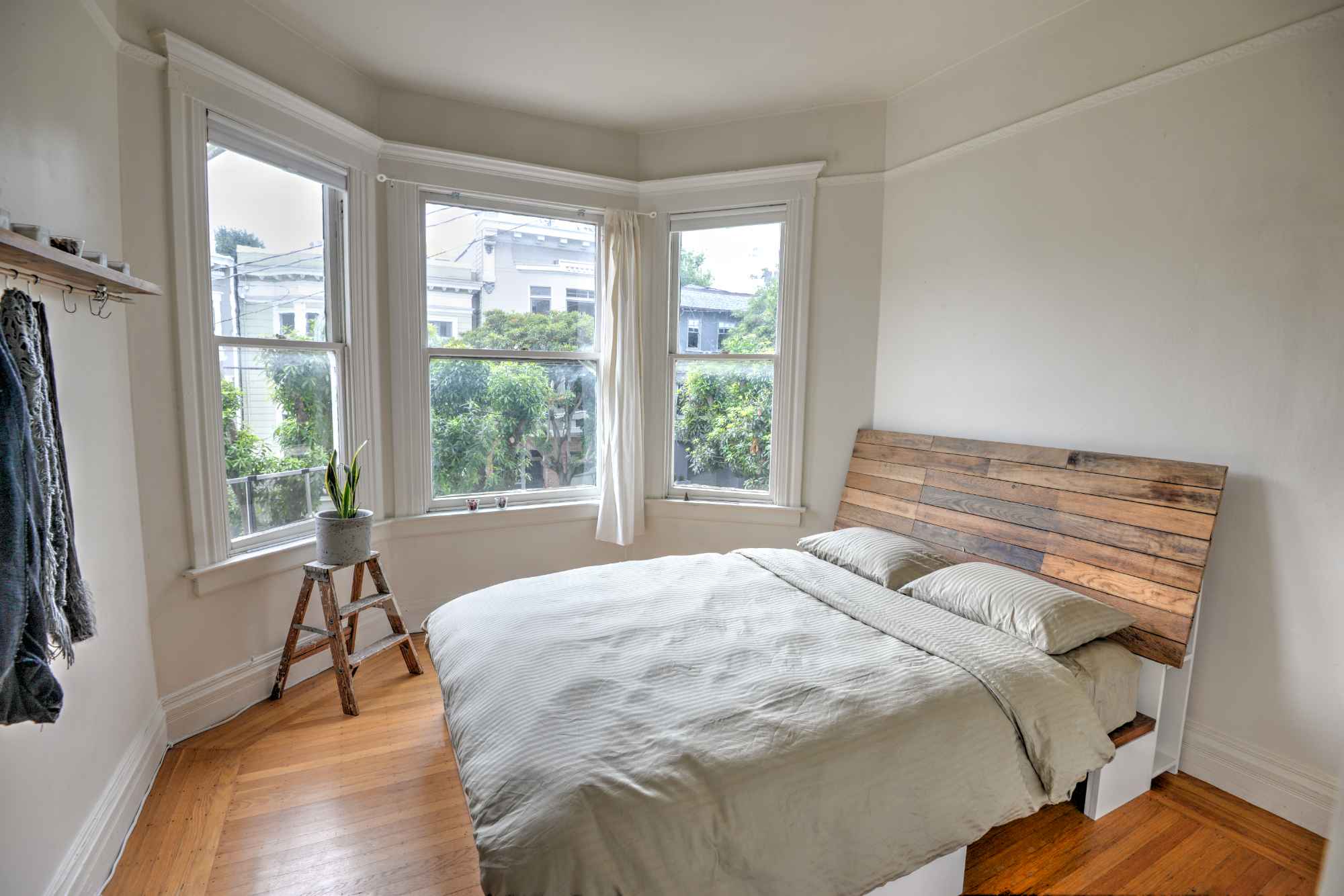 Seeking someone to move in as early as December 9, and stay as late as February 17, the dates are somewhat flexible. The room is approximately 130 sq. ft., with a custom built-in closet and bed. The closet and headboard are handcrafted, faced with reclaimed oak. It has sunny, south facing bay windows and it is fully furnished.
Also included for you is the sunny office space. It also has a triple south facing bay window. It features a large custom built desk on casters, printer-scanner-copier, and a chalkboard wall for your thoughts and ideas. A large monitor is available for you as well. The office will be solely for your use (except my roommate will water the plants weekly and possibly use the printer).
The flat is near Dolores Park and close to Valencia Street. Street parking is generally not too bad. Mostly hardwood floors throughout the flat. The kitchen features custom built reclaimed wood shelving and microcement kitchen island on casters. Also a living/dining room. The home is fully furnished. There is a backyard with garden. There is a clothes washer in the flat, and we use the energy saving smart dryer (clothesline/racks), also laundromats in the area.
There is space for a bike in the basement. A bike may be available for you if desired. A vehicle might also be available for your occasional use as well. Rent is $1800 per month. Utilities, internet, and common household items are a flat monthly fee of $150. A security deposit of $1800 is required.
We hope that your presence contributes to our home's relaxed and respectful vibe. Tidiness is very important to us. Although we're pretty busy with our lives and work, we aren't hermits. Basically, we like to maintain a light, good-humored atmosphere where one's independence is valued, while also sharing an occasional drink or meal. You will live with one male who works in the wine industry, he enjoys biking, hiking, and traveling. I am a female who works as a project manager at a small architecture firm. I enjoy building my own furniture, cooking, and traveling. I am the one traveling this winter whose office and room you will use. The two of us have been good friends for many years.
To clarify, you will have my room, plus my home office, roommate has his own room; the bathroom with clawfoot bathtub and shower is shared. The dates can be somewhat flexible for the right person. If you're an excellent communicator, have a steady source of income, perhaps a creative flair, and are fully engaged with your life, we'd love to hear from you! Please send us a detailed email that describes: your present situation, what you do to support yourself, your interests, your preferred move-in/move-out dates, and what you're looking for in a home. We would like to begin meeting people immediately.
Cheers!
