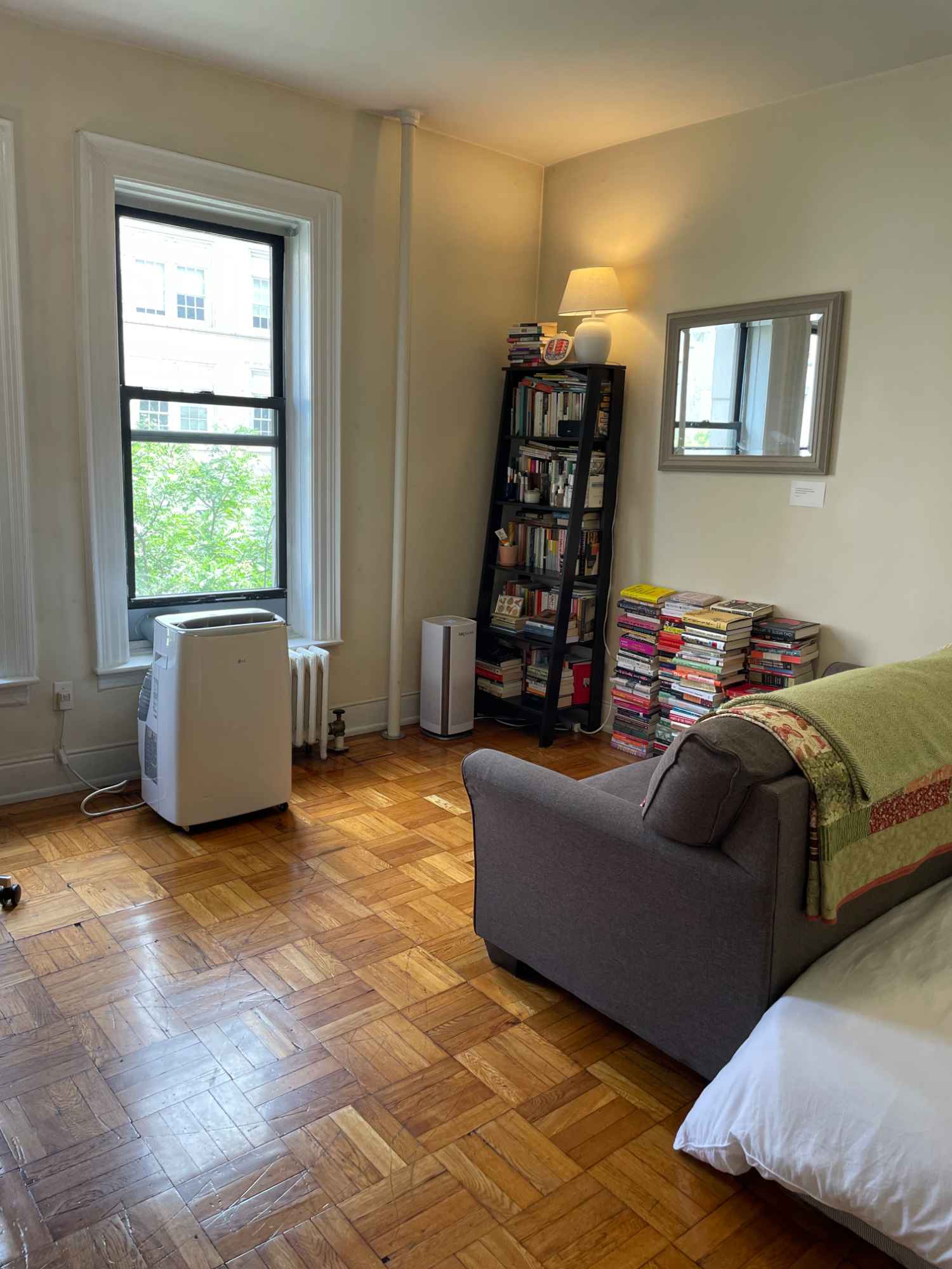 This room has two big windows that let in lots of light and two closets. The apartment has a in-unit washer/dryer combo, a good sized kitchen, a shower with tub, and the building has an elevator. The neighborhood is quiet and we are close to the 1 and A, B, C train lines. We are also close to grocery stores and parks.