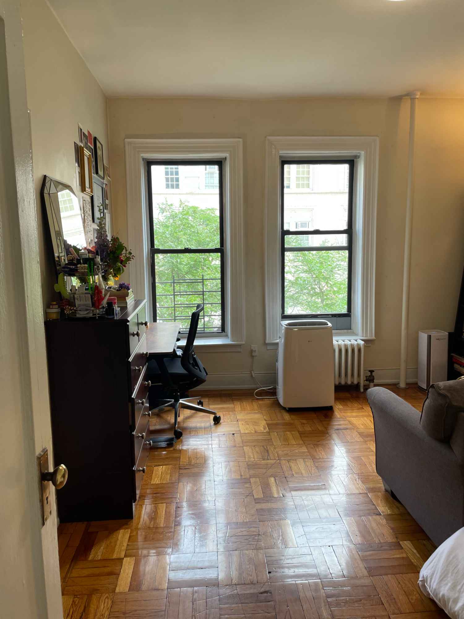 This room has two big windows that let in lots of light and two closets. The apartment has a in-unit washer/dryer combo, a good sized kitchen, a shower with tub, and the building has an elevator. The neighborhood is quiet and we are close to the 1 and A, B, C train lines. We are also close to grocery stores and parks.