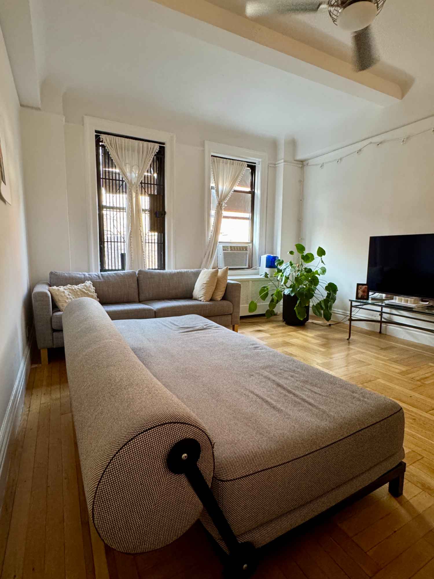 Spacious, sunny, furnished room in a clean, quiet apartment in UWS available Nov 1st. $2,100 (utilities included) for rental. I'm lookng for a roommate. The room you'll live has the door!

📐 Room Details:
Size: 12’6” x 17’8” with door (no lock)
Convertible XL bed (6’ 8.5” x 34 inches), large desk/dining table, floor lamp, hanger rack
You can use my queen air mattress
Bed sheets for either the Convertible XL Twin bed or air mattress are available if needed
Plant, a lamp, chairs, TV on the photo may be moved before your move-in

🛋️ Shared Space & Expectations:
Shoes off in all areas
Shared kitchen & bath (shower + tub, no dishwasher)
Use of non-food items in the kitchen allowed (except espresso machine); French press available
Clean after cooking/eating
Biweekly room & bath cleaning required (tools provided)

⚡ Amenities:
High-speed WiFi & all utilities included
Window A/C powerful and versatile

🏢 Building Rules:
No bikes in the apartment or elevator
Laundry is in the basement. You download an app to pay.

📍 Location:
UWS near Central Park, Hudson River, Trader Joe’s, Fairway, H-Mart, Levain, Tiki Chick, Shake Shack
Subway: 1 train (W 79 St) & B/C trains (W 81 St) nearby

📅 Terms:
$2,100/month — Includes all utilities & furnishings
$2,100 refundable security deposit after move-out inspection
Security deposit required to claim the room.
Pay the rent 2 days prior to the move-in date.
E-mail receipt will be provided.
Rent is due every 31 days from the move-in date.
Rent payment via Zelle, Venmo, or money order (if no U.S. bank account) via Walmart or USPS.
1-month minimum stay
Month-to-month lease with flexible move-out — just provide 30 days’ notice.

🙋 Ideal Roommate:
Respectful, quiet, tidy professional, student, work in office, visitors, global trotters, internationals…
No smoking, guests, pets, or pests
Who is not at home much is prefererd.
Quiet hours: 10pm–6am

📬 Message with a short intro + desired move-in date. Or schedule for a visit as soon as you can.
Thank you! Looking forward to meeting you.

