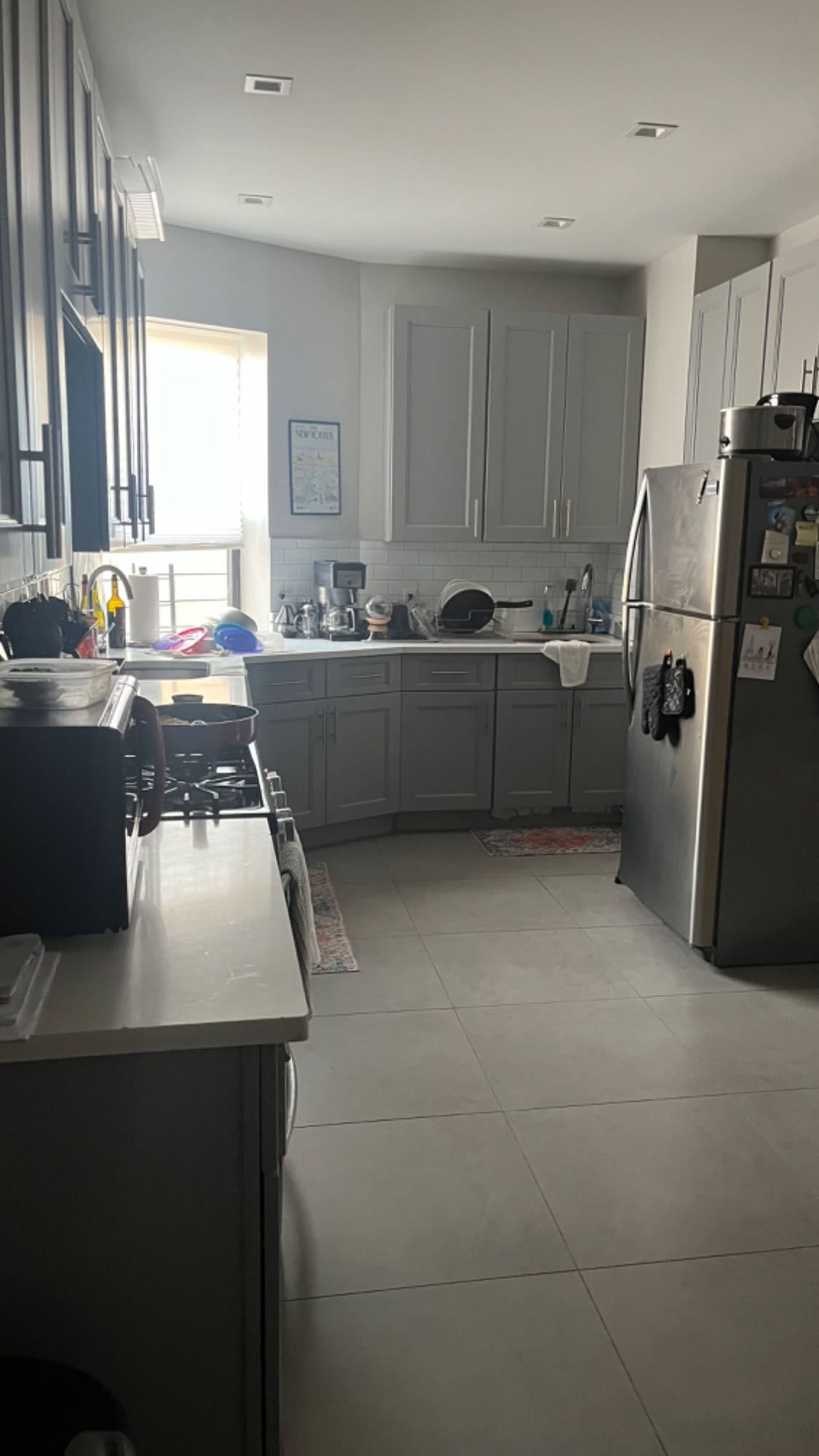 The neighborhood is nice. Rather quiet. The unit is a large three bedroom of which I am looking to fill two rooms. One room is the largest room, and the other is the smallest room. I occupy the medium sized room. We have in unit laundry. With a large living room and dining area and good sized kitchen. The super and landlord are attentive and timely to any issues we have had. I do have a small dog and cat.