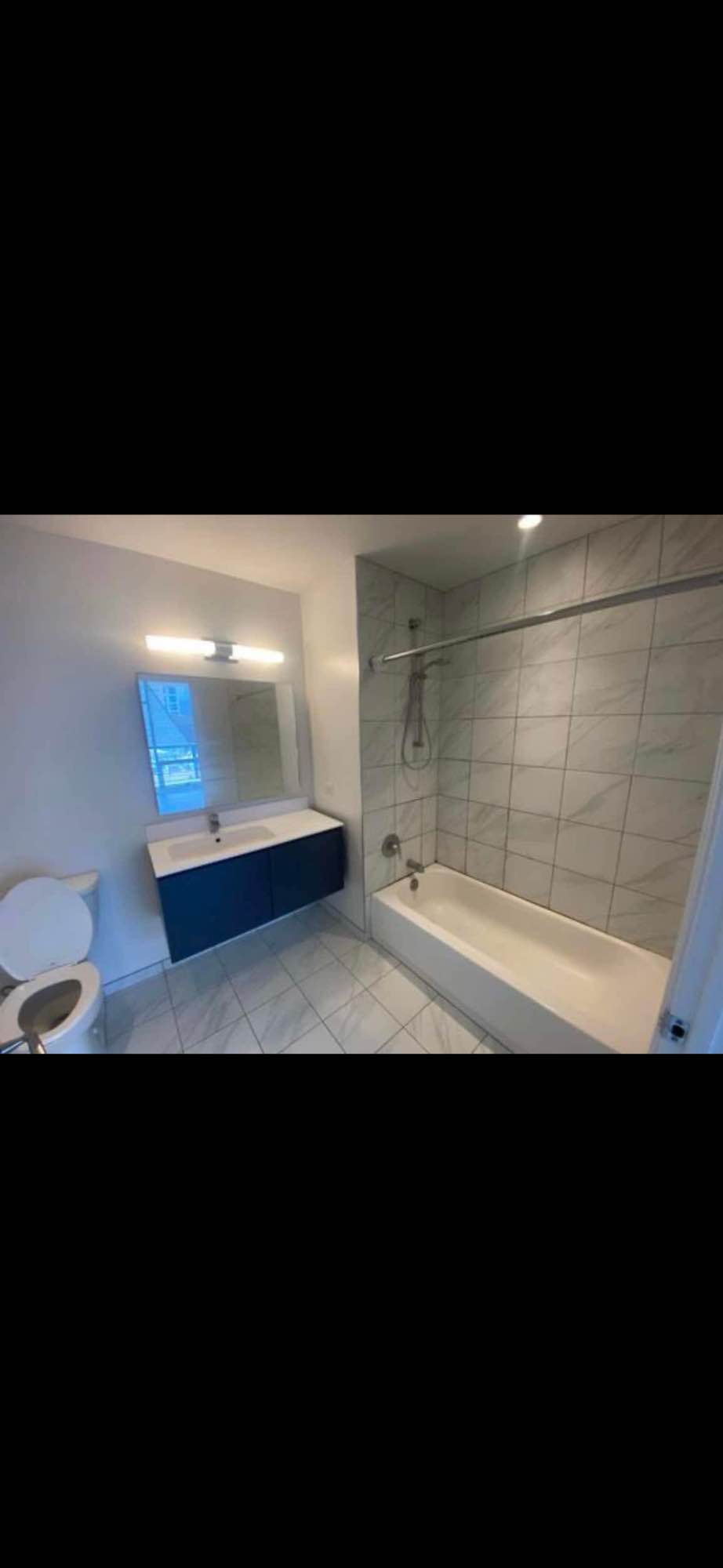 Large studio apartment with balcony, kitchen, dishwasher, and in unit washer and dryer. The building also has a gym and rooftop with a pool! Happy to answer other additional questions.