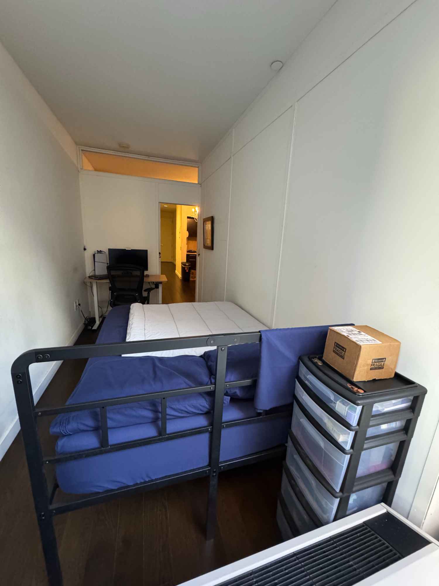 This is the biggest bedroom of the three in the unit. The apartment has a washer and dryer in-unit as well as a dishwasher. It's a luxury building with a mailroom, on-site leasing office, gym, lounge, and two outdoor rooftop spaces with a basketball court and grills available for use. 