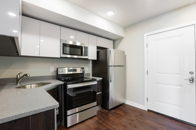 Includes kitchen with appliances and small eating space. Downstairs has a small living space with couch and tv. Bedroom has its own bathroom with shower and toilet. 